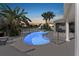 Tranquil pool featuring blue glow at twilight and spa with mature landscaping and waterway views at 4503 Jacona Dr, Hernando Beach, FL 34607