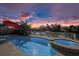 Beautiful pool and spa area with stunning twilight sky and a view of the waterway at 4503 Jacona Dr, Hernando Beach, FL 34607