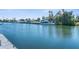 Picture-perfect waterfront views showcasing a private dock, boat lift, and access to boating and water activities at 4503 Jacona Dr, Hernando Beach, FL 34607