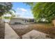 Spacious backyard featuring a covered patio and ample green space at 4559 Crescent Rd, Spring Hill, FL 34606