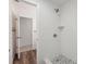 Updated bathroom featuring a tiled walk-in shower with pebble stone floor at 4559 Crescent Rd, Spring Hill, FL 34606