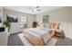 Well-lit bedroom with a plush bed, two windows, and modern décor at 4559 Crescent Rd, Spring Hill, FL 34606