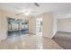 Open-concept dining area with tiled floors, a ceiling fan, and sliding glass doors to a screened-in porch at 4559 Crescent Rd, Spring Hill, FL 34606