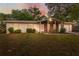 Charming single-story home featuring a brick accent wall and a well-maintained front lawn at 4559 Crescent Rd, Spring Hill, FL 34606