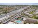 Aerial view of the community showcasing the condos, canal, boat docks, pool, and meticulously maintained landscaping at 4632 Marine Pkwy # 201, New Port Richey, FL 34652