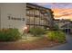 Beautiful condo building with lush landscaping and covered walkways at 4632 Marine Pkwy # 201, New Port Richey, FL 34652