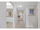 Hallway featuring tile flooring and access to the kitchen and living areas at 4632 Marine Pkwy # 201, New Port Richey, FL 34652