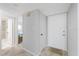 Inviting hallway with neutral colors and access to rooms with updated flooring at 4632 Marine Pkwy # 201, New Port Richey, FL 34652