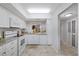 Bright kitchen featuring white cabinets, granite countertops, and modern appliances at 4632 Marine Pkwy # 201, New Port Richey, FL 34652
