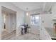 Eat-in kitchen featuring a snack bar and modern white appliances at 4632 Marine Pkwy # 201, New Port Richey, FL 34652