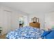 Spacious primary bedroom with furniture, neutral walls, and closet space at 4632 Marine Pkwy # 201, New Port Richey, FL 34652
