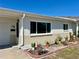 Single story home with neutral stucco exterior and well maintained yard, featuring tasteful potted plant accents at 4653 Cambridge Ave # 4653, New Port Richey, FL 34652