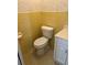 Bathroom featuring yellow tiles, a toilet and a white vanity with a white countertop at 5335 Embassy Ave # 5335, New Port Richey, FL 34652
