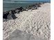 Beautiful sandy beach with tranquil water, perfect for relaxing strolls and enjoying the serene coastal atmosphere at 5335 Embassy Ave # 5335, New Port Richey, FL 34652