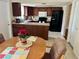 Open kitchen with wood cabinets, black appliances and breakfast bar, perfect for entertaining at 5335 Embassy Ave # 5335, New Port Richey, FL 34652