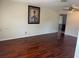Large living room with hardwood floors, neutral paint, and a ceiling fan at 5335 Embassy Ave # 5335, New Port Richey, FL 34652
