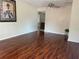 Spacious living room with hardwood floors, neutral paint, and a ceiling fan at 5335 Embassy Ave # 5335, New Port Richey, FL 34652