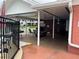This covered patio area features furniture for relaxing or entertaining, and adjoins the community pool and recreation areas at 5335 Embassy Ave # 5335, New Port Richey, FL 34652