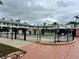 A community swimming pool is surrounded by a secure fence and is centrally located within this multi-Gathering residential property at 5335 Embassy Ave # 5335, New Port Richey, FL 34652