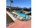 This community features a refreshing pool and spa, poolside seating, and lush landscaping at 5335 Embassy Ave # 5335, New Port Richey, FL 34652