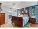 Comfortable main bedroom with wood floors and ensuite bathroom at 5342 Leisure St, Dade City, FL 33523