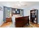 Comfortable main bedroom with wood floors, a large window, and ample natural light at 5342 Leisure St, Dade City, FL 33523