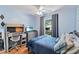 Comfortable bedroom with a desk, television, and window view at 5342 Leisure St, Dade City, FL 33523