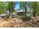 Well-maintained single-story home surrounded by mature trees, offering curb appeal and a sense of privacy at 5342 Leisure St, Dade City, FL 33523