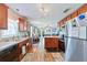 Modern kitchen with stainless steel appliances, a functional layout, and seamless connection to the living area at 5342 Leisure St, Dade City, FL 33523