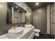 Stylish bathroom with dual sinks, modern fixtures, and a glass shower at 5417 Carlton Rd, New Port Richey, FL 34652