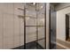 Modern bathroom showcasing a glass shower with dual sink vanity at 5417 Carlton Rd, New Port Richey, FL 34652