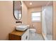 Updated bathroom with stylish vanity, modern fixtures, and a shower with decorative tile at 5417 Carlton Rd, New Port Richey, FL 34652