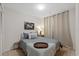 Cozy bedroom featuring a comfortable bed with soft pillows, ambient lighting, and calming decor at 5417 Carlton Rd, New Port Richey, FL 34652