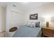 Comfortable bedroom with a queen-sized bed, soft lighting, and ample closet space at 5417 Carlton Rd, New Port Richey, FL 34652