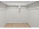 Empty closet with tile floors and white walls offer ample storage space, and allow for customization at 5417 Carlton Rd, New Port Richey, FL 34652
