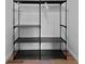 Open closet system featuring adjustable shelves, hanging racks, and a sleek design for organized storage at 5417 Carlton Rd, New Port Richey, FL 34652