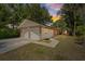 Exterior of a charming single-story home featuring a two-car garage at 5417 Carlton Rd, New Port Richey, FL 34652