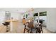 Bright kitchen with breakfast bar, stainless steel appliances, and dining area, perfect for Gathering meals at 5417 Carlton Rd, New Port Richey, FL 34652