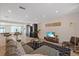 Open concept living room with a sectional sofa and decorative rug at 5417 Carlton Rd, New Port Richey, FL 34652