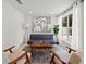Inviting living area with neutral decor, a comfortable couch, stylish chairs, and a view of the pool at 5417 Carlton Rd, New Port Richey, FL 34652