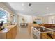 Open-concept living space with a modern kitchen and living room featuring natural light at 5417 Carlton Rd, New Port Richey, FL 34652