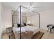 Well-lit main bedroom with large bed, window views, and tasteful interior design at 5417 Carlton Rd, New Port Richey, FL 34652