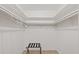 Spacious walk-in closet with ample shelving, rods and tiled flooring at 5417 Carlton Rd, New Port Richey, FL 34652
