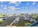 Waterfront view showing docks, and boatlifts and beautiful blue sky and clouds at 5537 Sea Forest Dr # 301, New Port Richey, FL 34652