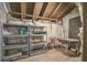 Unfinished attic with wood-beamed ceilings and plenty of storage space on shelves at 5537 Sea Forest Dr # 301, New Port Richey, FL 34652