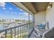 Inviting balcony with Adirondack chairs, offering stunning views of the marina and waterfront at 5537 Sea Forest Dr # 301, New Port Richey, FL 34652
