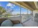 Relaxing balcony area with seating, overlooking the serene waterfront, boats and neighborhood at 5537 Sea Forest Dr # 301, New Port Richey, FL 34652