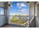 Balcony view of water with docks, boats, and blue sky, offering a serene outdoor retreat at 5537 Sea Forest Dr # 301, New Port Richey, FL 34652
