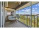 Comfortable balcony with seating, providing a relaxing outdoor space with scenic neighborhood views at 5537 Sea Forest Dr # 301, New Port Richey, FL 34652