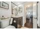 Bathroom featuring a vanity and a view into the dining area at 5537 Sea Forest Dr # 301, New Port Richey, FL 34652